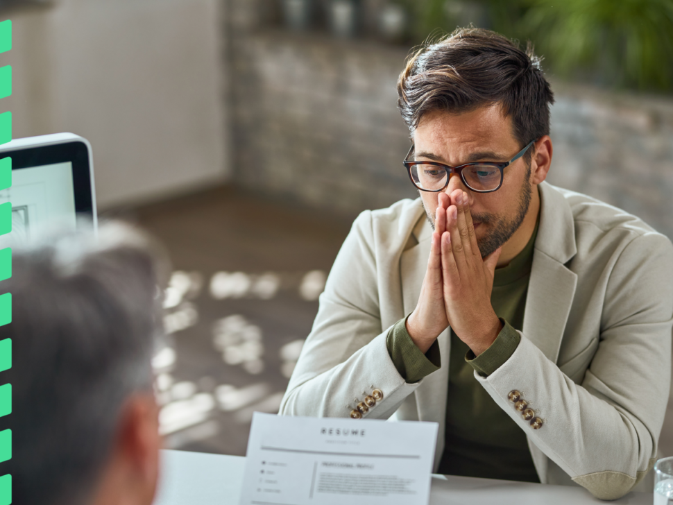 distraught-young-man-feeling-uncertain-while-having-job-interview-office